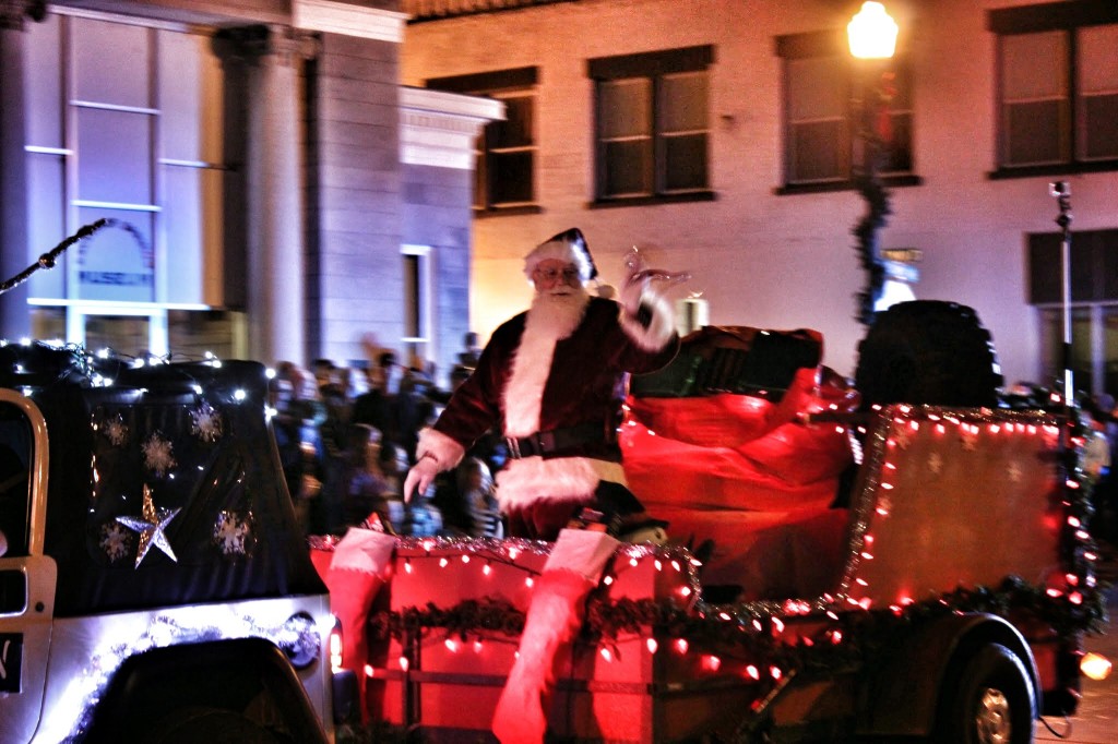 Santa waves from the sleigh as he wraps up the parade
